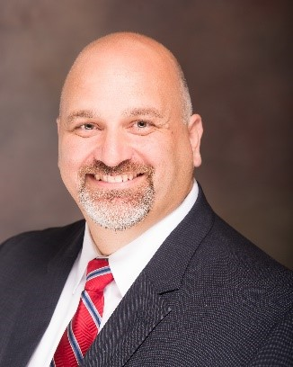 A man smiling at the camera.